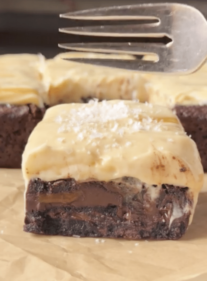 Fork with frosted brownie.