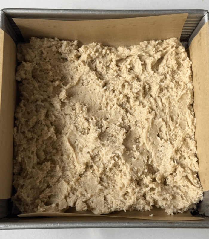 Cake batter in square pan.