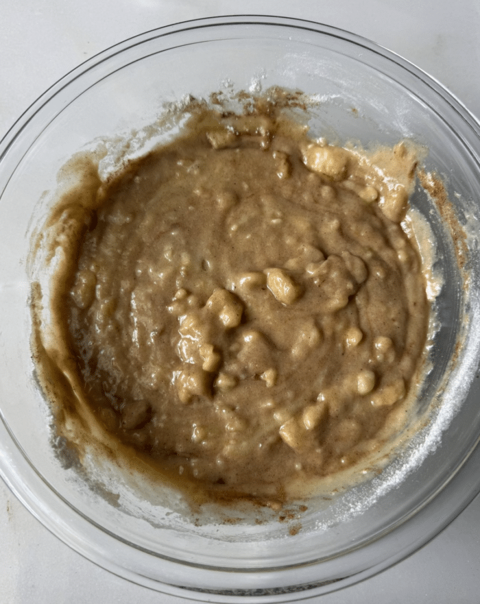 Mashed banana batter in bowl.