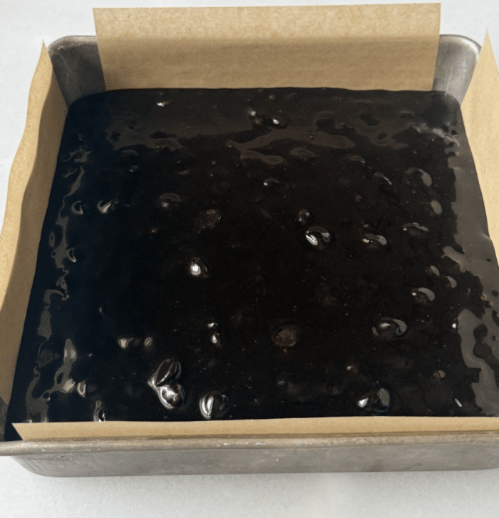 Dark batter in square pan.