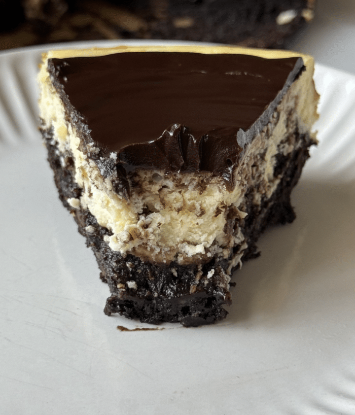 Bite of brownie cheesecake.