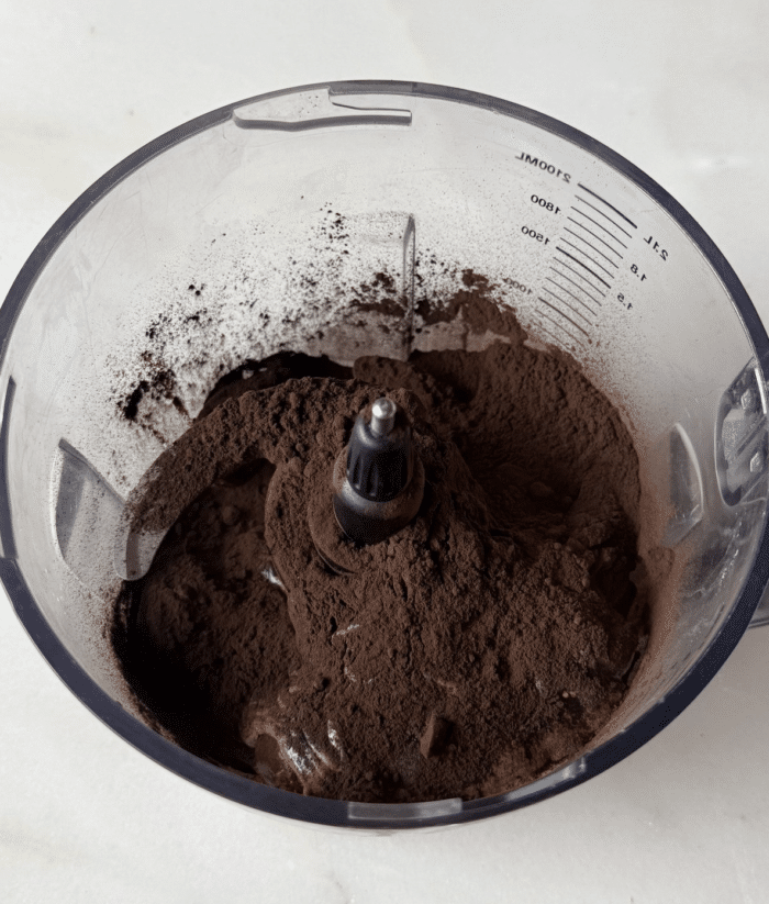 Food processor with cocoa powder.