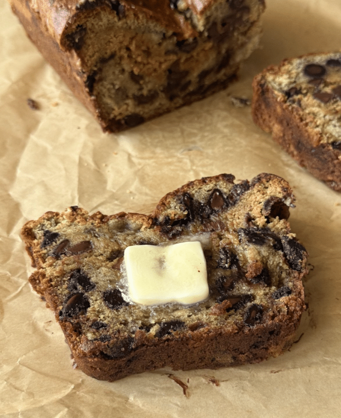 Cookie dough stuffed banana bread with butter.